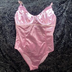 Shiny new pink bodysuit